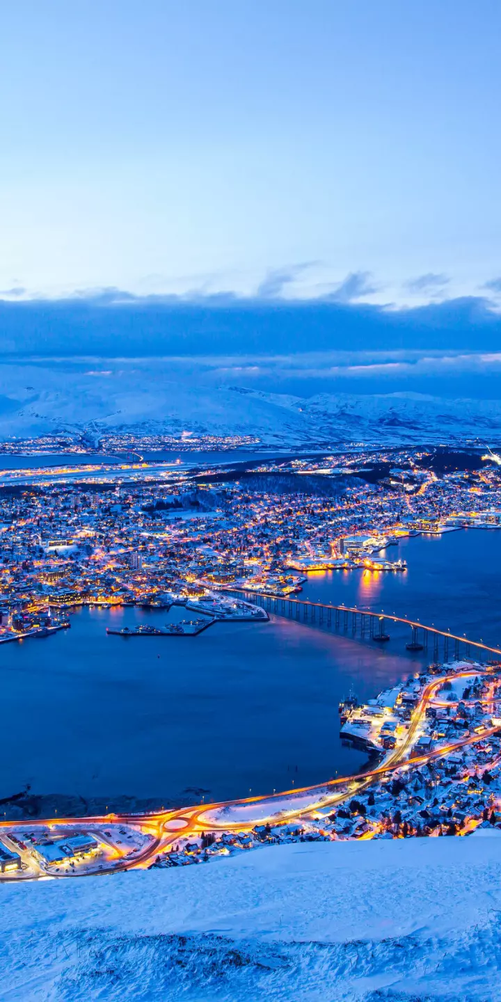 Aerial view of Tromsø taken from Mt Storsteinen, that is reached by Fjellheisen cable car. Tromsø is located in northern Norway that running third of the largest urban area north of the Arctic Circle.
