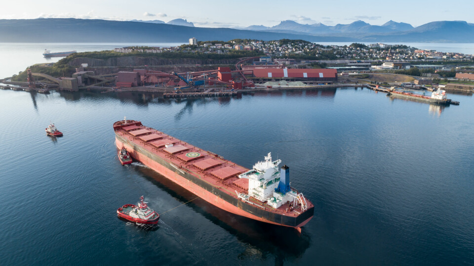 Aerial,Shot,Of,A,Cargo,Ship,Approaching,Port,Terminal,With